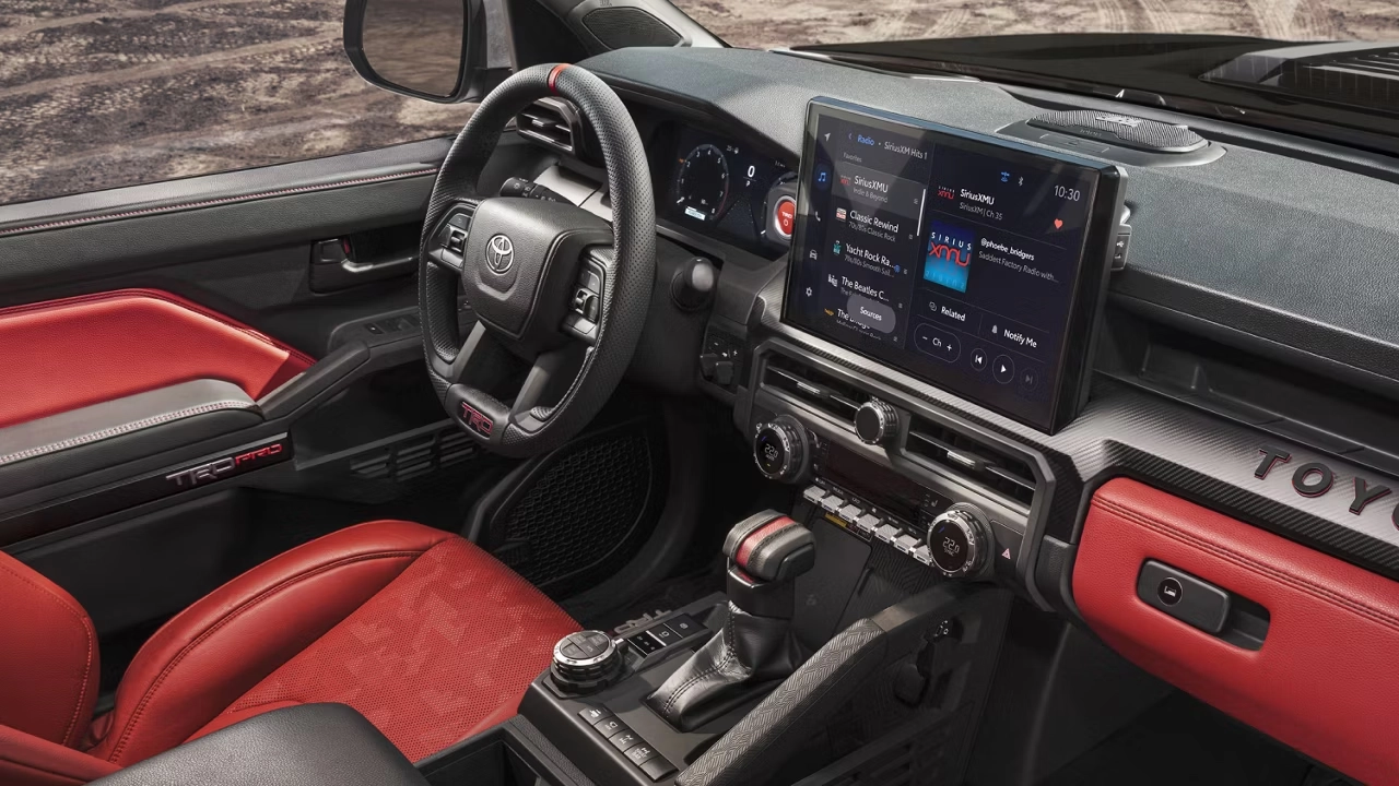 Toyota Tacoma TRD Pro interior with red leather seats and a 14-inch touchscreen