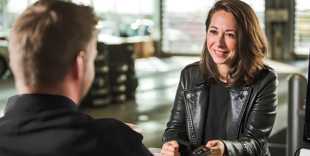 Customer speaking with an advisor about Toyota Extra Care Protection and extended coverage.