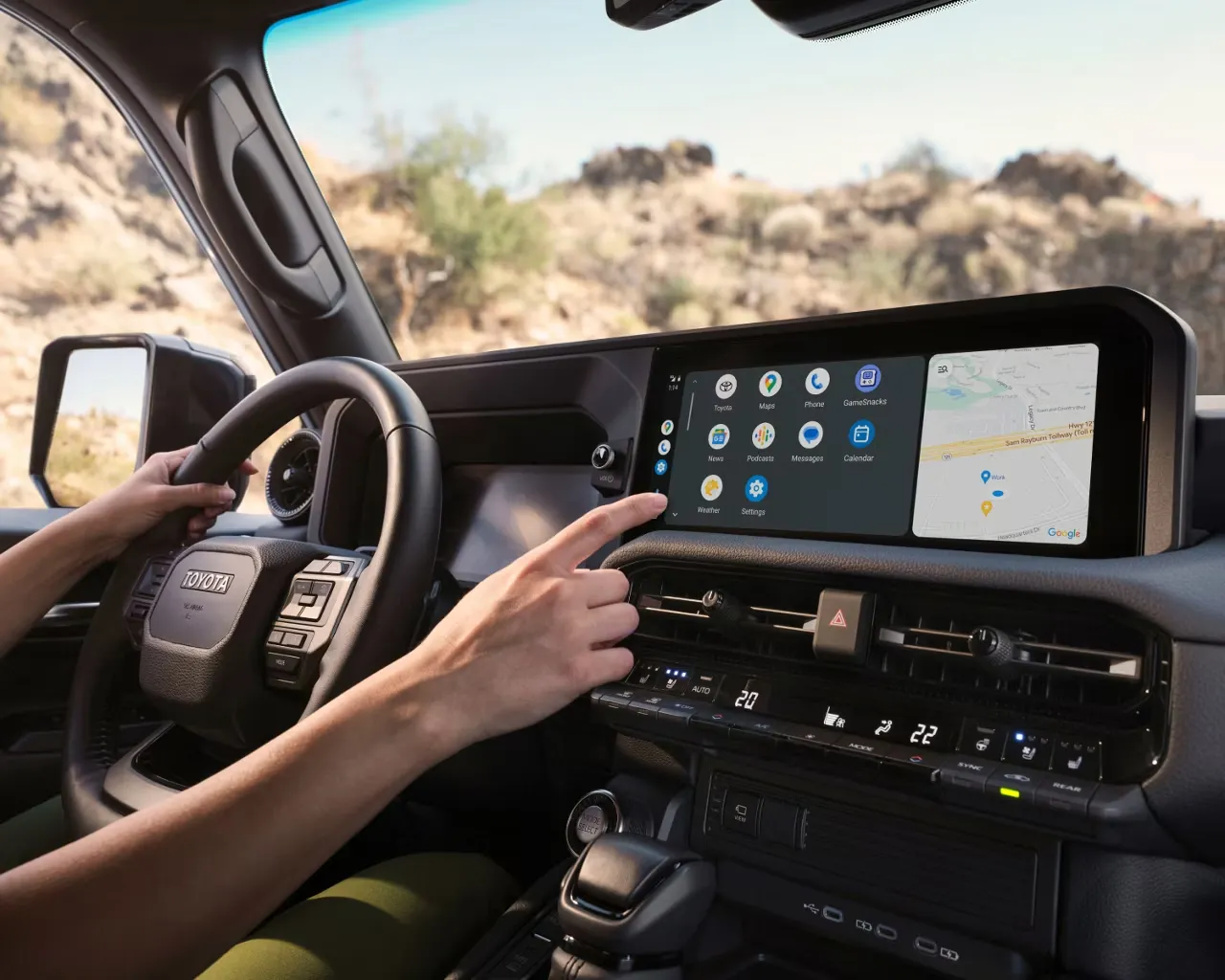 2027 Toyota Land Cruiser multimedia display showing apps and navigation on the dashboard.