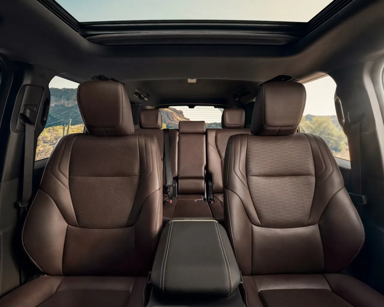 2027 Toyota Land Cruiser interior with brown seats, rear bench, and sunroof.